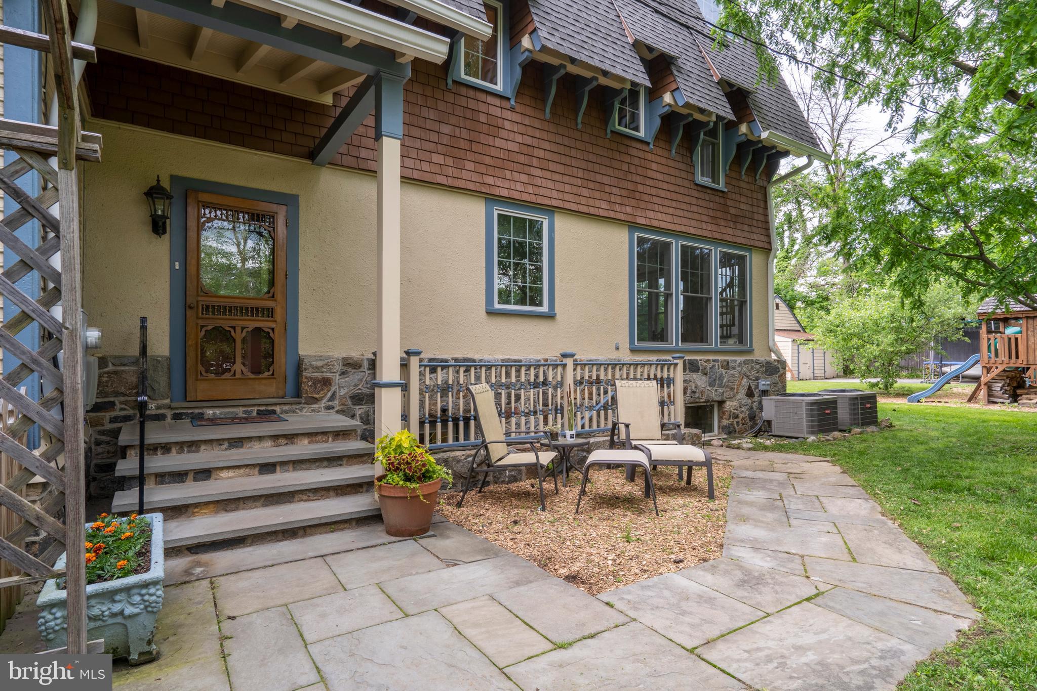 301 Midland Avenue Wayne, PA 19087 - Photo 48 of 63 a view of a house with backyard sitting area and garden