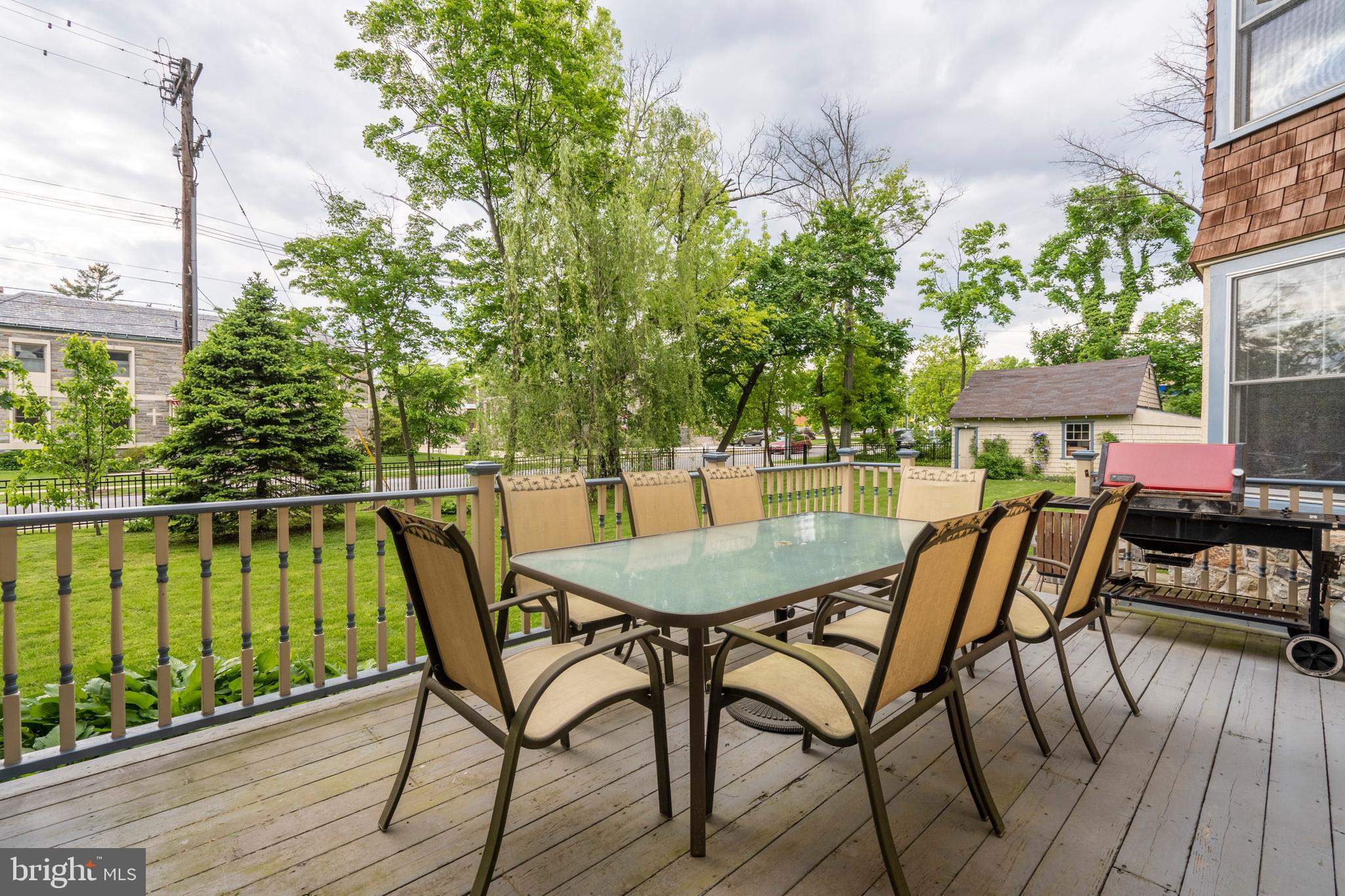 301 Midland Avenue Wayne, PA 19087 - Photo 50 of 63 a patio with wooden floor table and chairs
