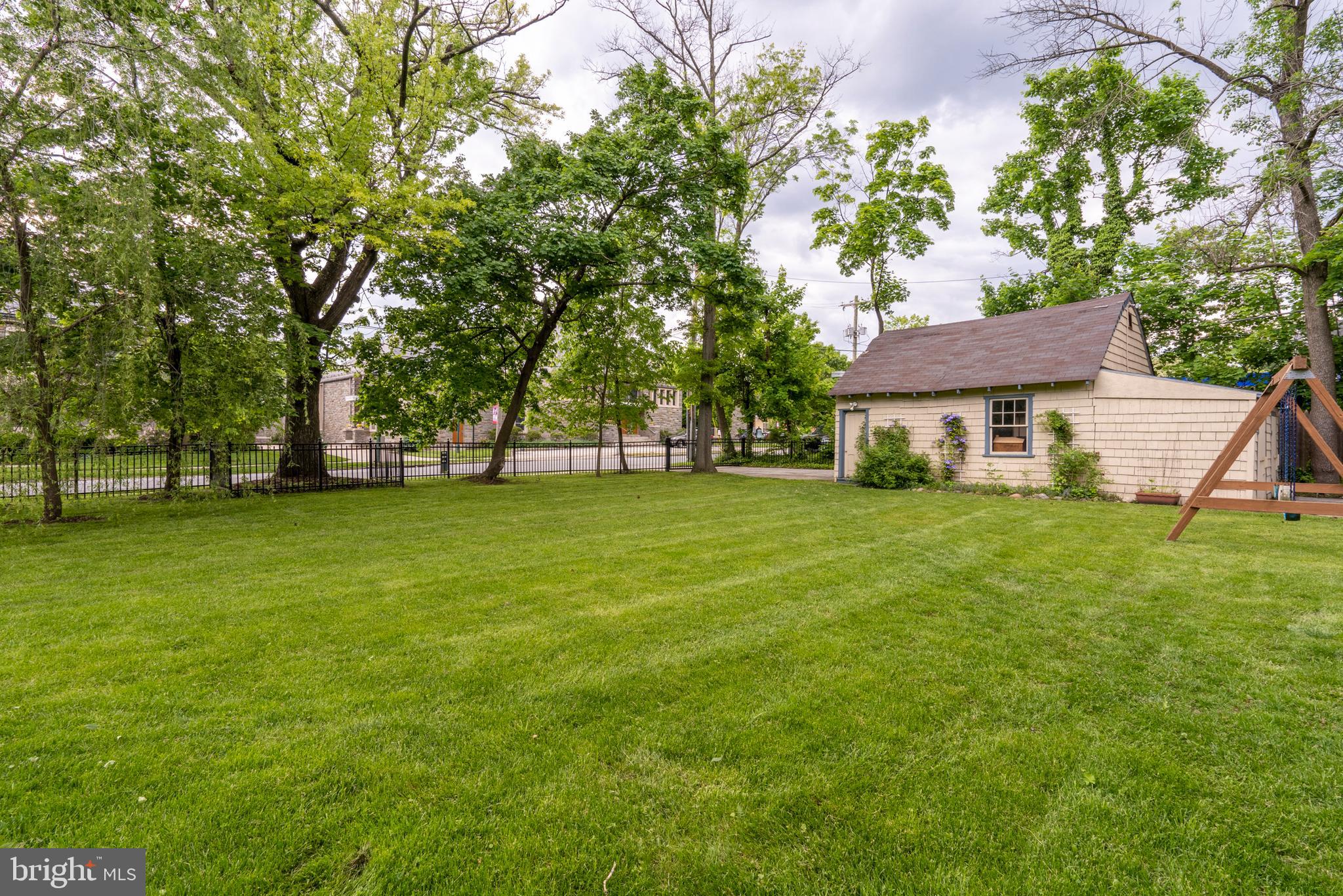 301 Midland Avenue Wayne, PA 19087 - Photo 61 of 63 a front view of a house with garden