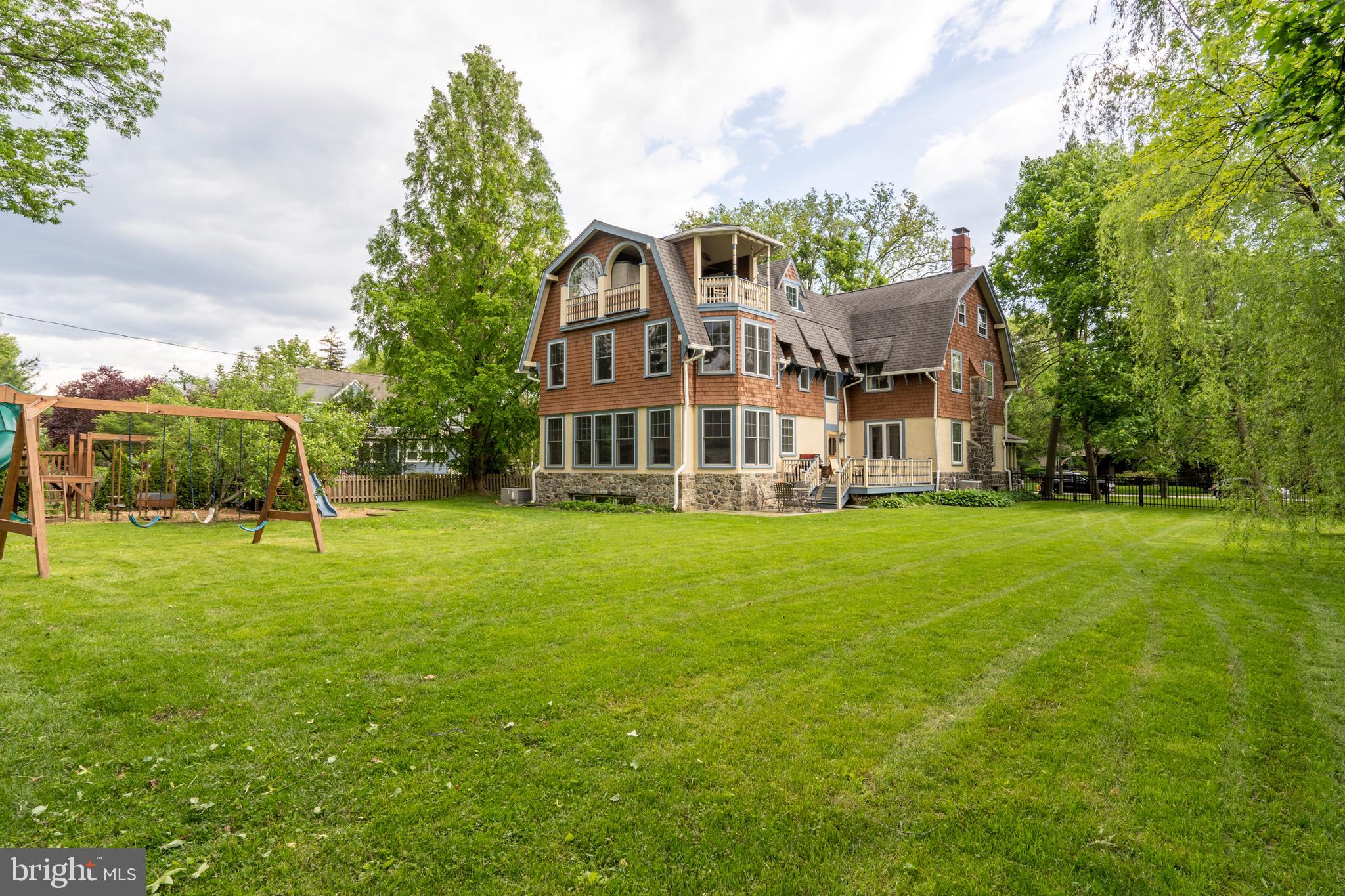301 Midland Avenue Wayne, PA 19087 - Photo 62 of 63 a front view of a house with a yard