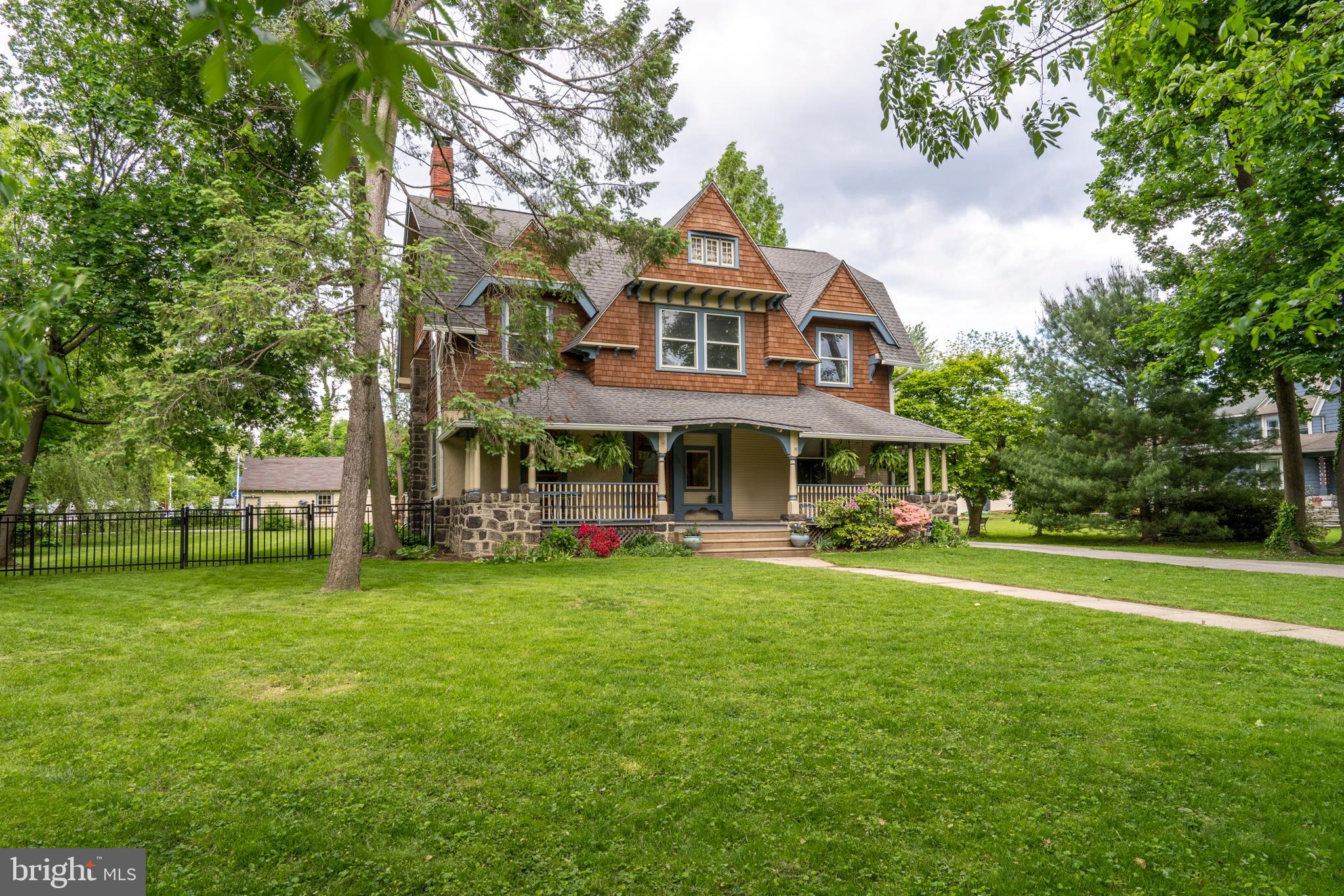 301 Midland Avenue Wayne, PA 19087 - Photo 63 of 63 a front view of a house with a garden
