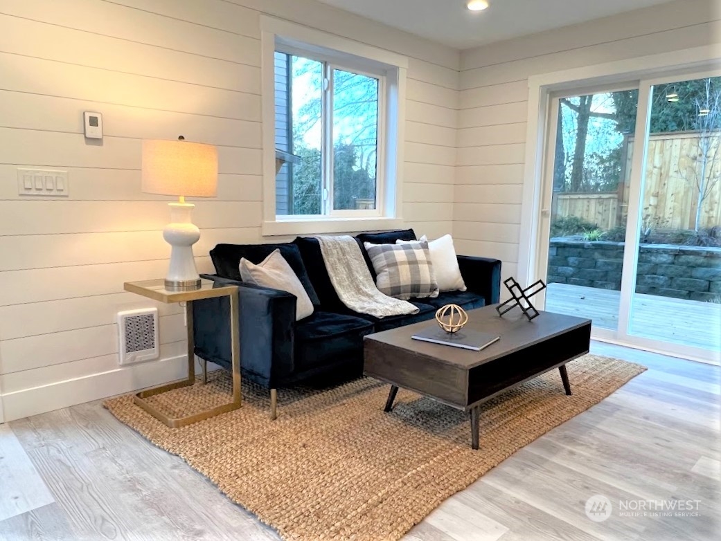 3303 31st Avenue Southwest, Unit B Seattle, WA 98126 - Photo 14 of 26 a living room with furniture and a rug