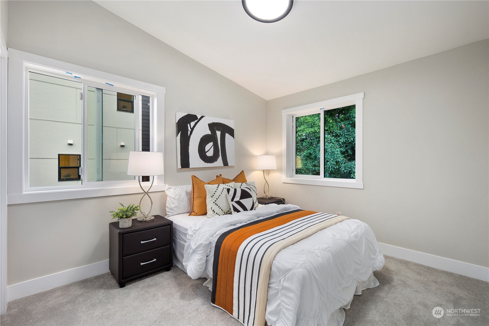 3303 31st Avenue Southwest, Unit B Seattle, WA 98126 - Photo 15 of 26 a bedroom with a bed and a window