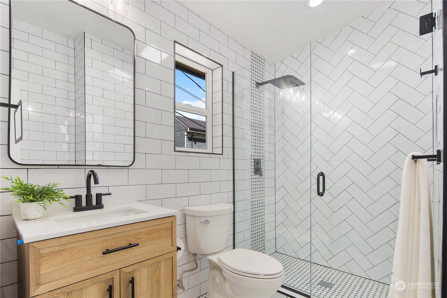3303 31st Avenue Southwest, Unit B Seattle, WA 98126 - Photo 17 of 26 a bathroom with a sink a toilet and shower