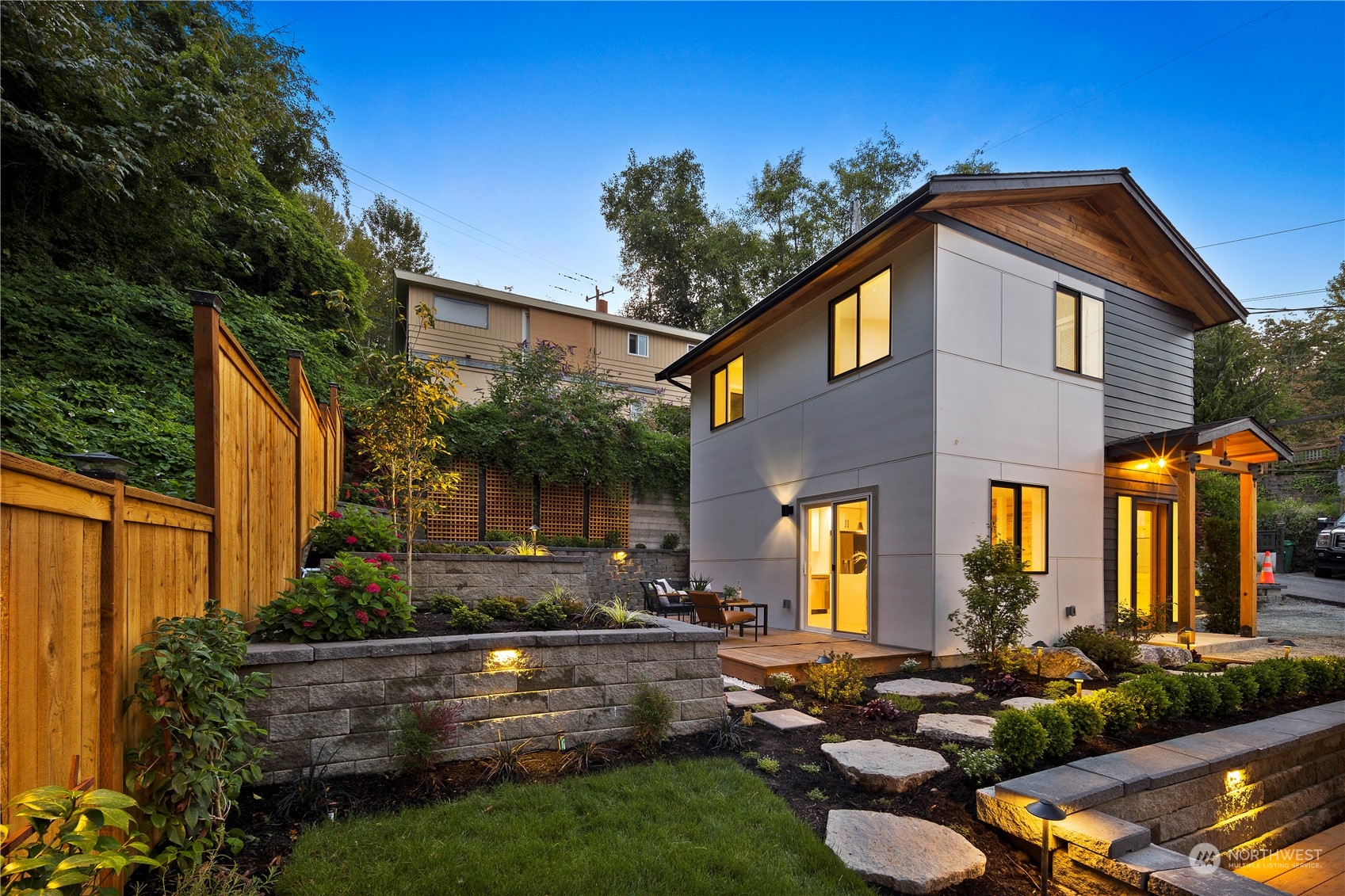 3303 31st Avenue Southwest, Unit B Seattle, WA 98126 - Photo 19 of 26 a front view of a house with garden