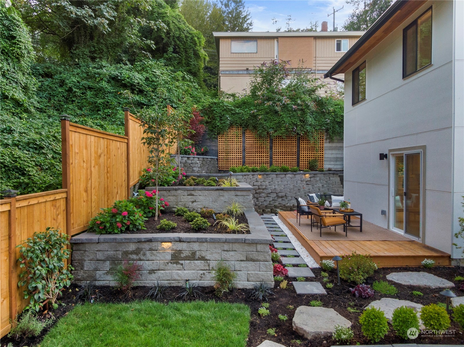 3303 31st Avenue Southwest, Unit B Seattle, WA 98126 - Photo 20 of 26 a front view of a house with a yard