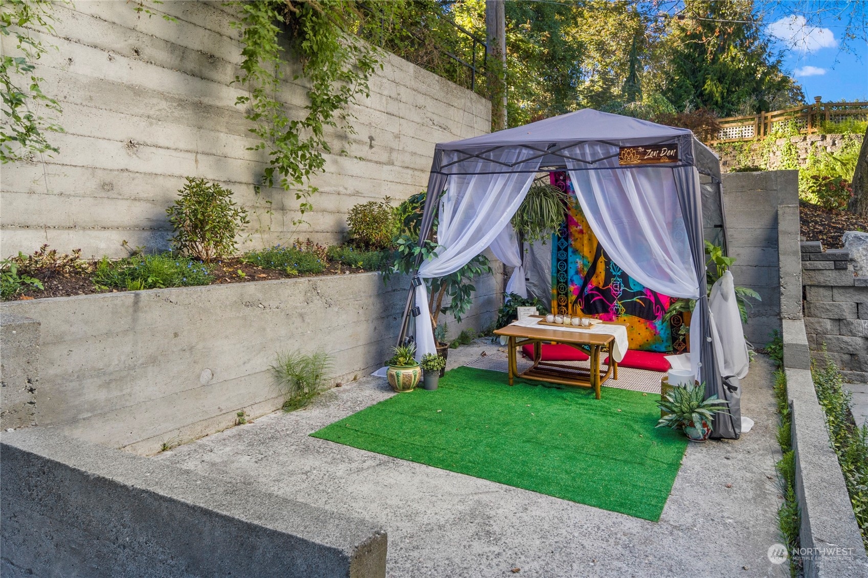 3303 31st Avenue Southwest, Unit B Seattle, WA 98126 - Photo 23 of 26 a aerial view of a house with swimming pool and wooden fence