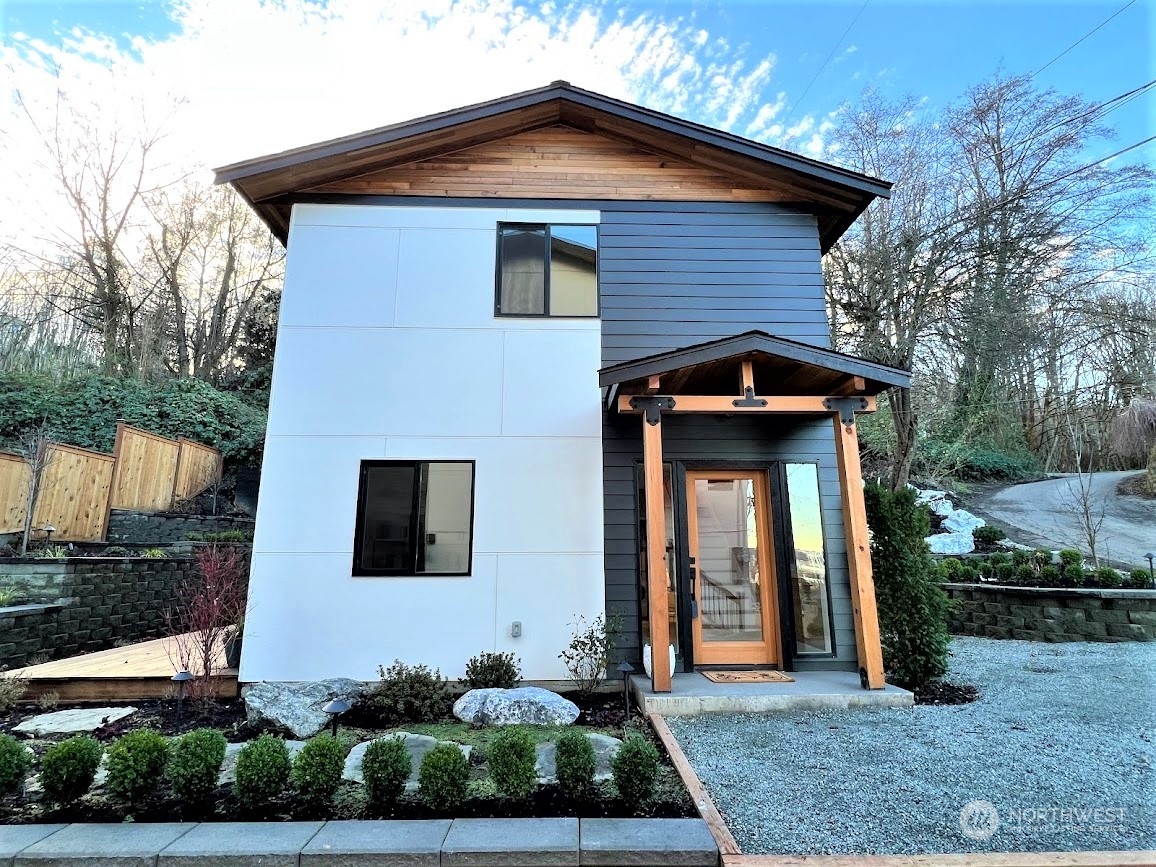 3303 31st Avenue Southwest, Unit B Seattle, WA 98126 - Photo 26 of 26 a front view of a house with garden