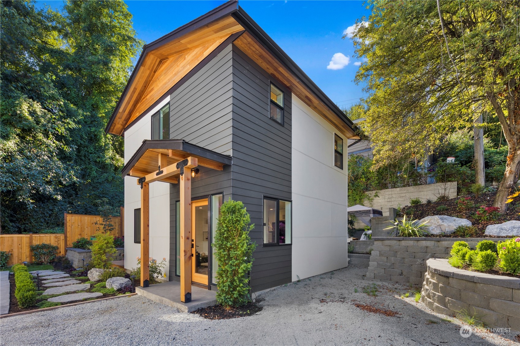 3303 31st Avenue Southwest, Unit B Seattle, WA 98126 - Photo 3 of 26 a front view of a house with garden
