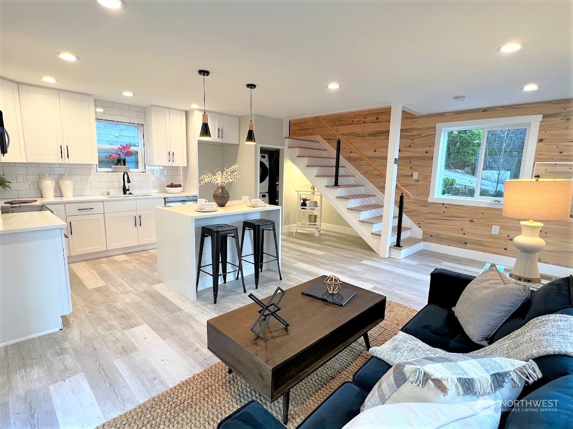 3303 31st Avenue Southwest, Unit B Seattle, WA 98126 - Photo 5 of 26 a living room with furniture rug and a large window