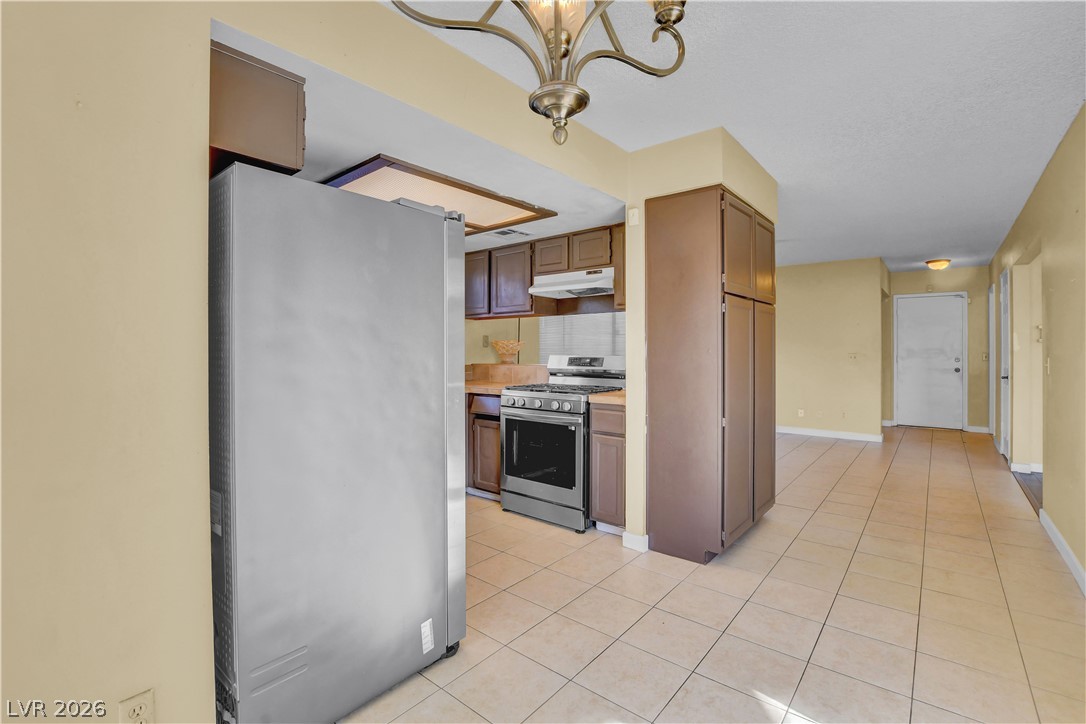6440 Hartwood Road Las Vegas, NV 89108 - Photo 17 of 59 A functional kitchen provides ample storage and efficient appliances.