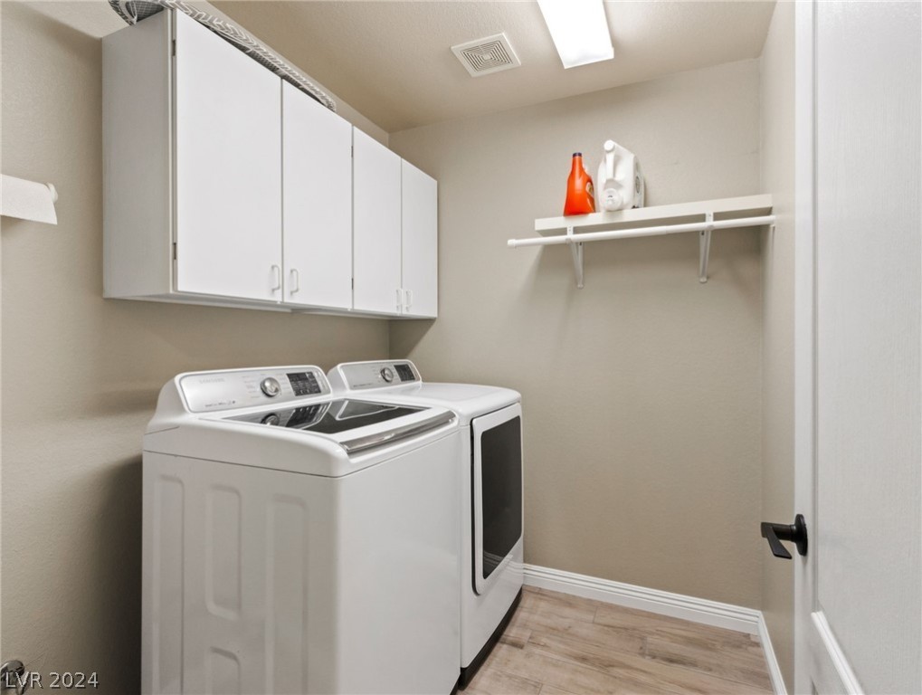 365 Kenya Road Las Vegas, NV 89123 - Photo 25 of 47 Separate laundry room with storage cabinets and pl