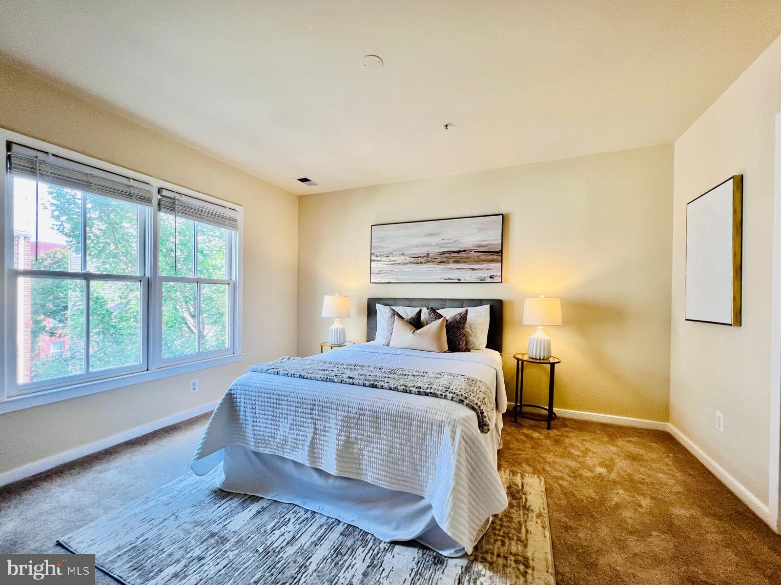 2301 Cobble Hill Terrace Silver Spring, MD 20902 - Photo 11 of 28 a bedroom with a large bed and a window