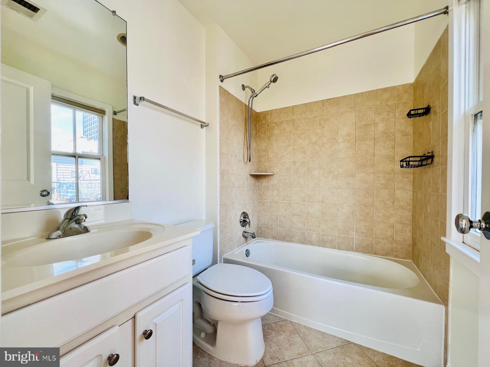 2301 Cobble Hill Terrace Silver Spring, MD 20902 - Photo 16 of 28 a bathroom with a sink a toilet and a bathtub