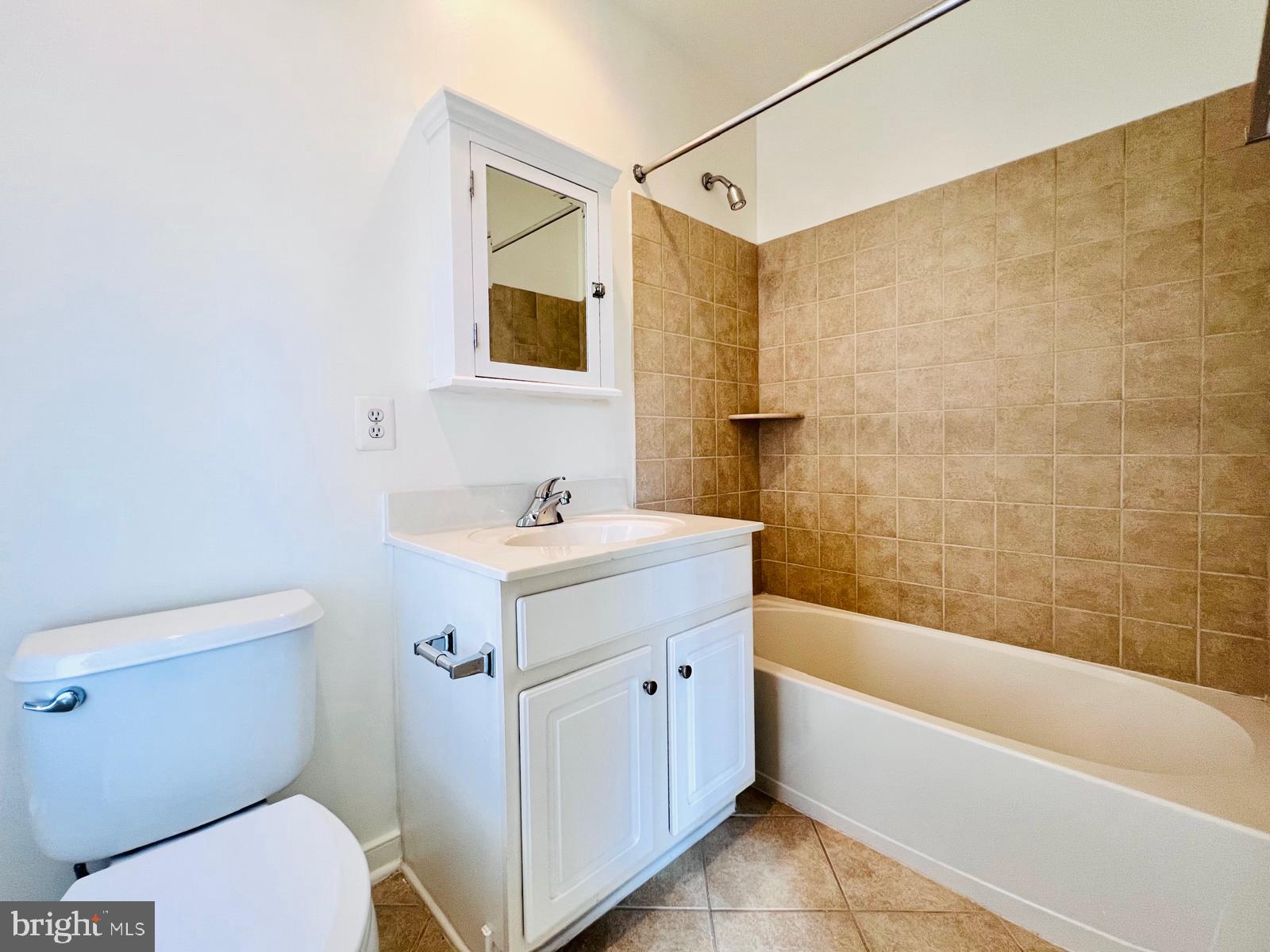2301 Cobble Hill Terrace Silver Spring, MD 20902 - Photo 18 of 28 a bathroom with a sink a toilet and bathtub