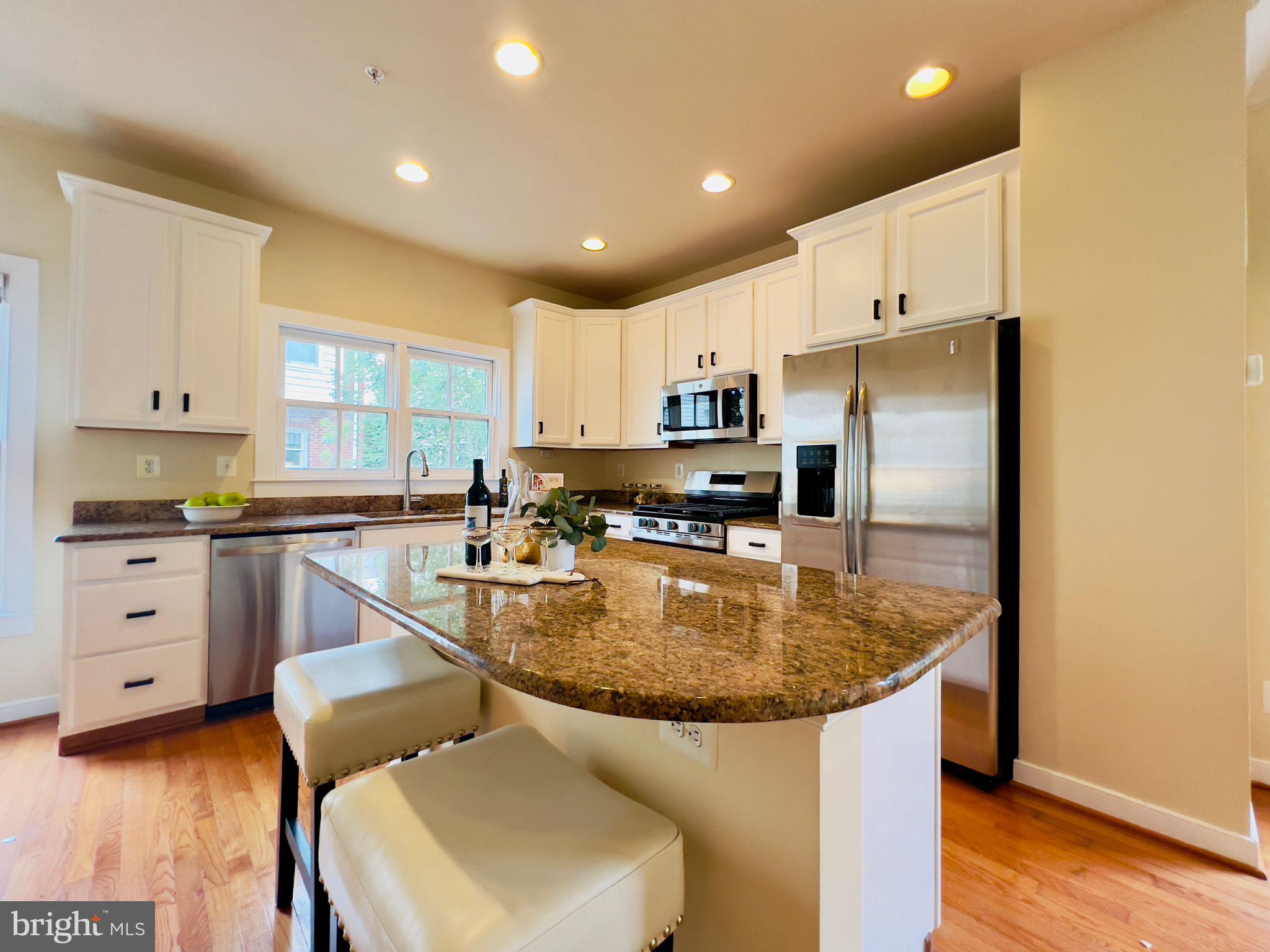 2301 Cobble Hill Terrace Silver Spring, MD 20902 - Photo 5 of 28 a kitchen with kitchen island a appliances a sink a center island and cabinets