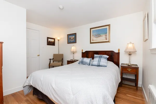 a bed room with a bed and a night stand