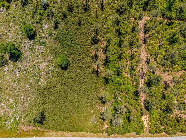 a view of a large body of water with a mountain in the background