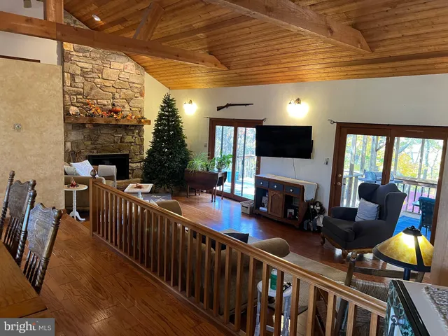 a view of a dining room with furniture wooden floor and chandelier