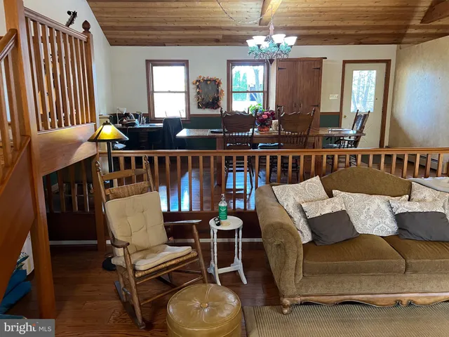 a bedroom with a bed and wooden cabinets