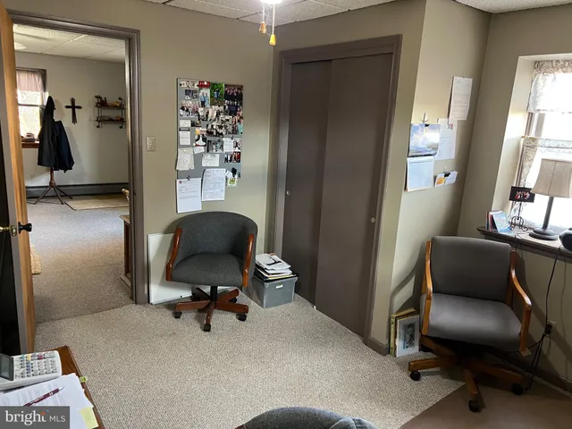 a view of entryway livingroom and hall with wooden floor