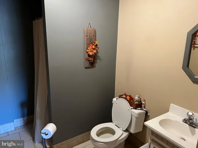 a bedroom with a bed dresser and a window