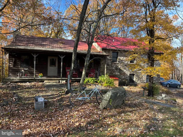 a view of a house with a truck parked in front of a house