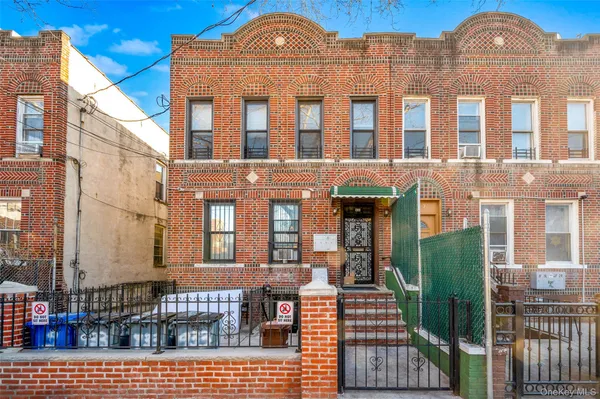 a view of a brick building with many windows