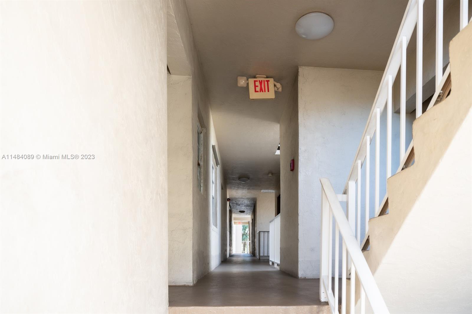 7715 Southwest 86th Street, Unit A2307 Miami, FL 33143 - Photo 3 of 89 a view of an entryway with a kitchen