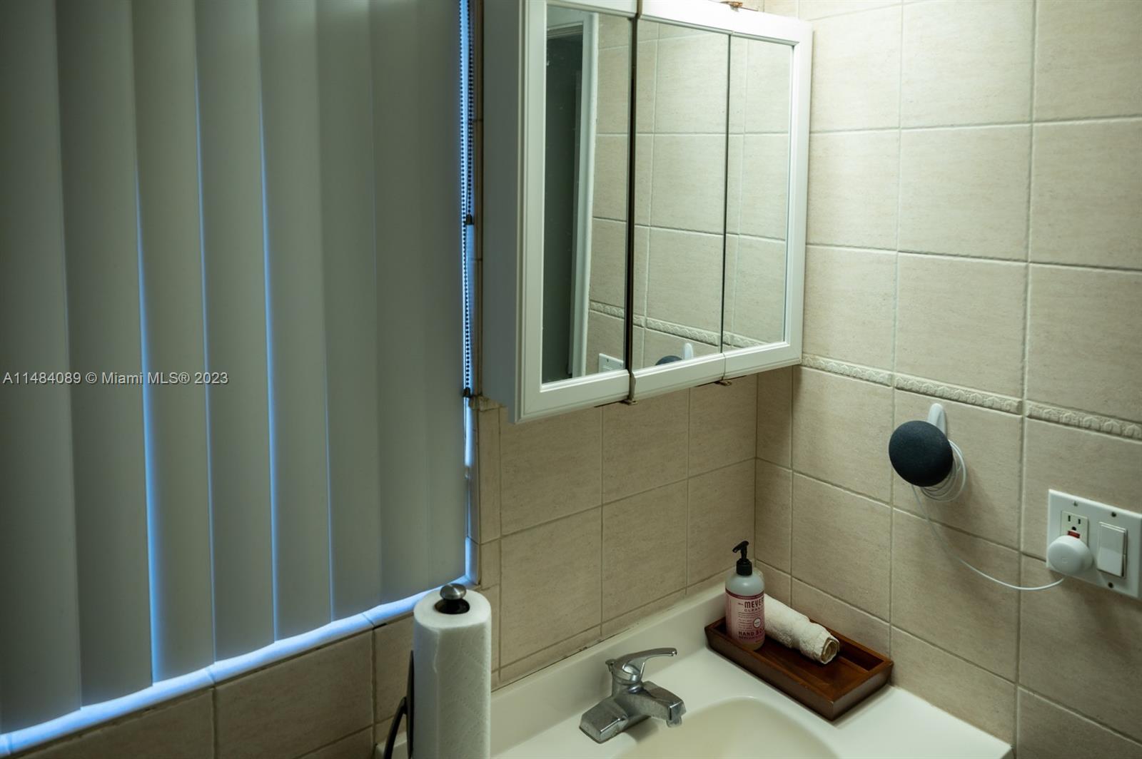 7715 Southwest 86th Street, Unit A2307 Miami, FL 33143 - Photo 39 of 89 a bathroom with a shower