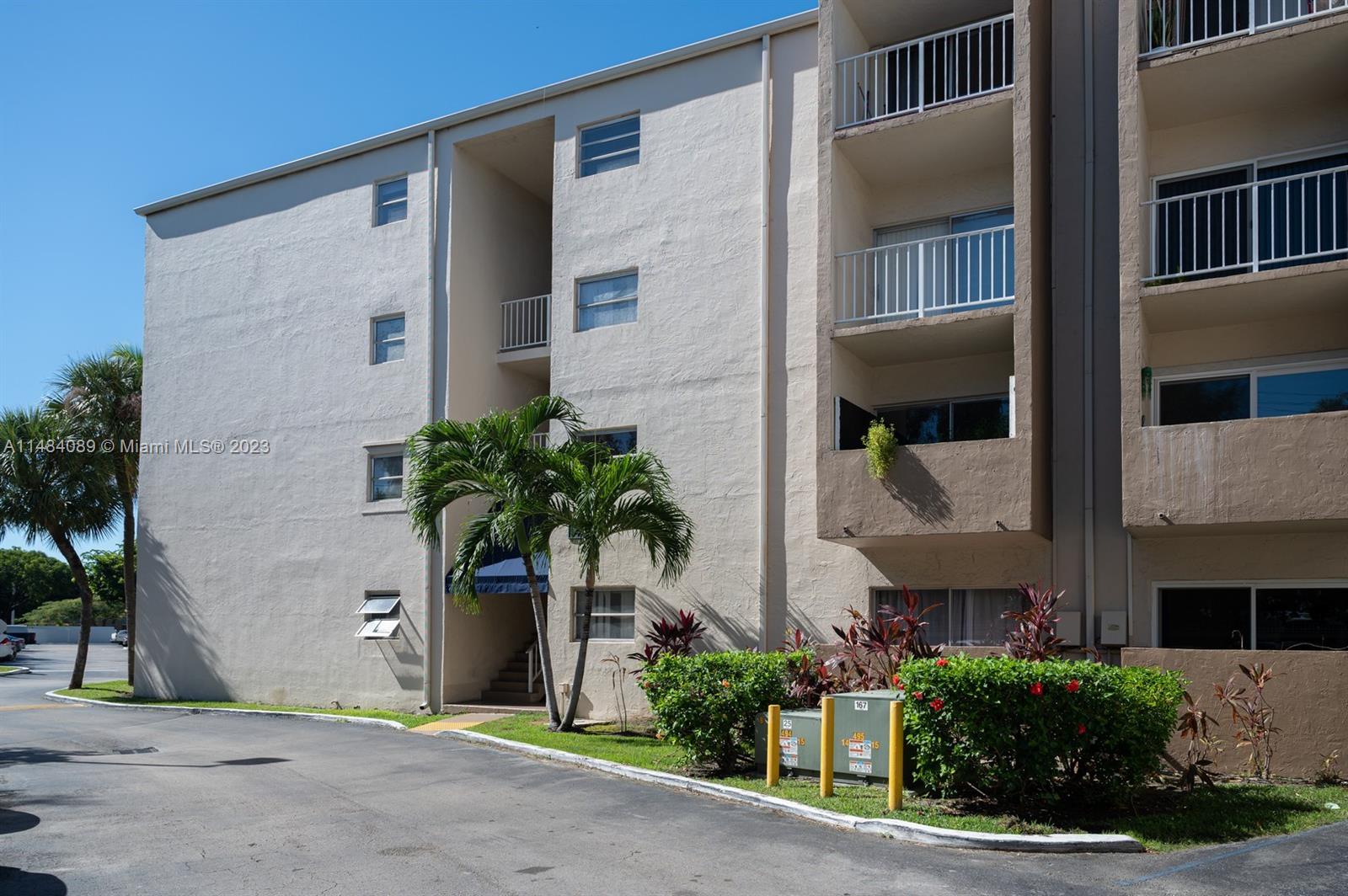 7715 Southwest 86th Street, Unit A2307 Miami, FL 33143 - Photo 63 of 89 a front view of a house with a yard