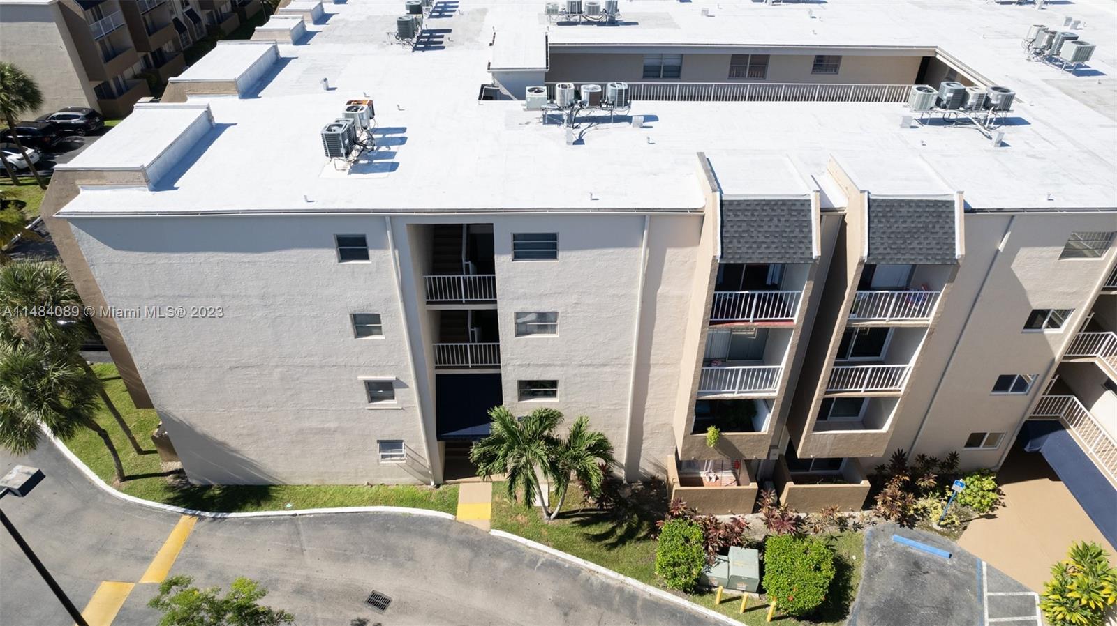 7715 Southwest 86th Street, Unit A2307 Miami, FL 33143 - Photo 71 of 89 a view of multiple house with outdoor space