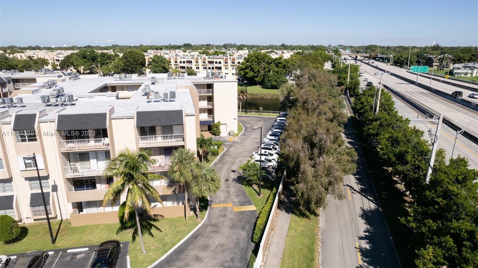 7715 Southwest 86th Street, Unit A2307 Miami, FL 33143 - Photo 75 of 89 a picture of city view with outdoor space