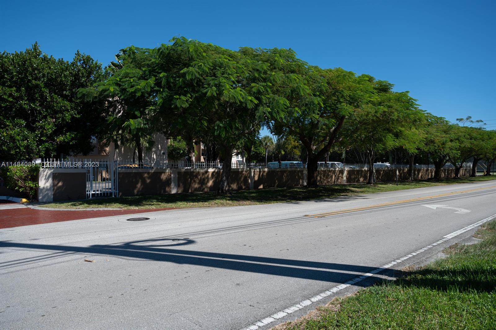 7715 Southwest 86th Street, Unit A2307 Miami, FL 33143 - Photo 87 of 89 front view of a house with a street