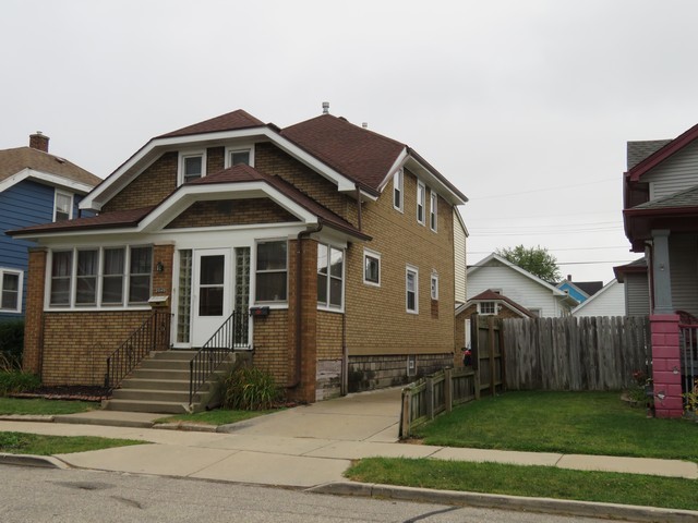 2040 Carter Street Racine, WI 53402 - Photo 1 of 19 a front view of a house with a yard