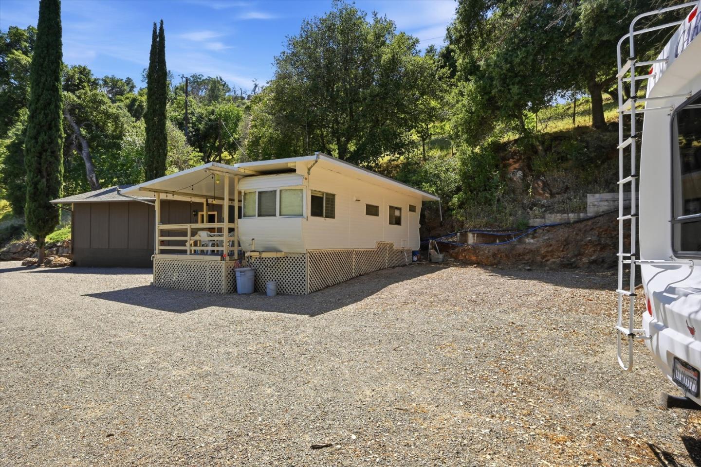 5156 Lake Road Lower Lake, CA 95457 - Photo 22 of 27 a front view of a house with a yard and garage
