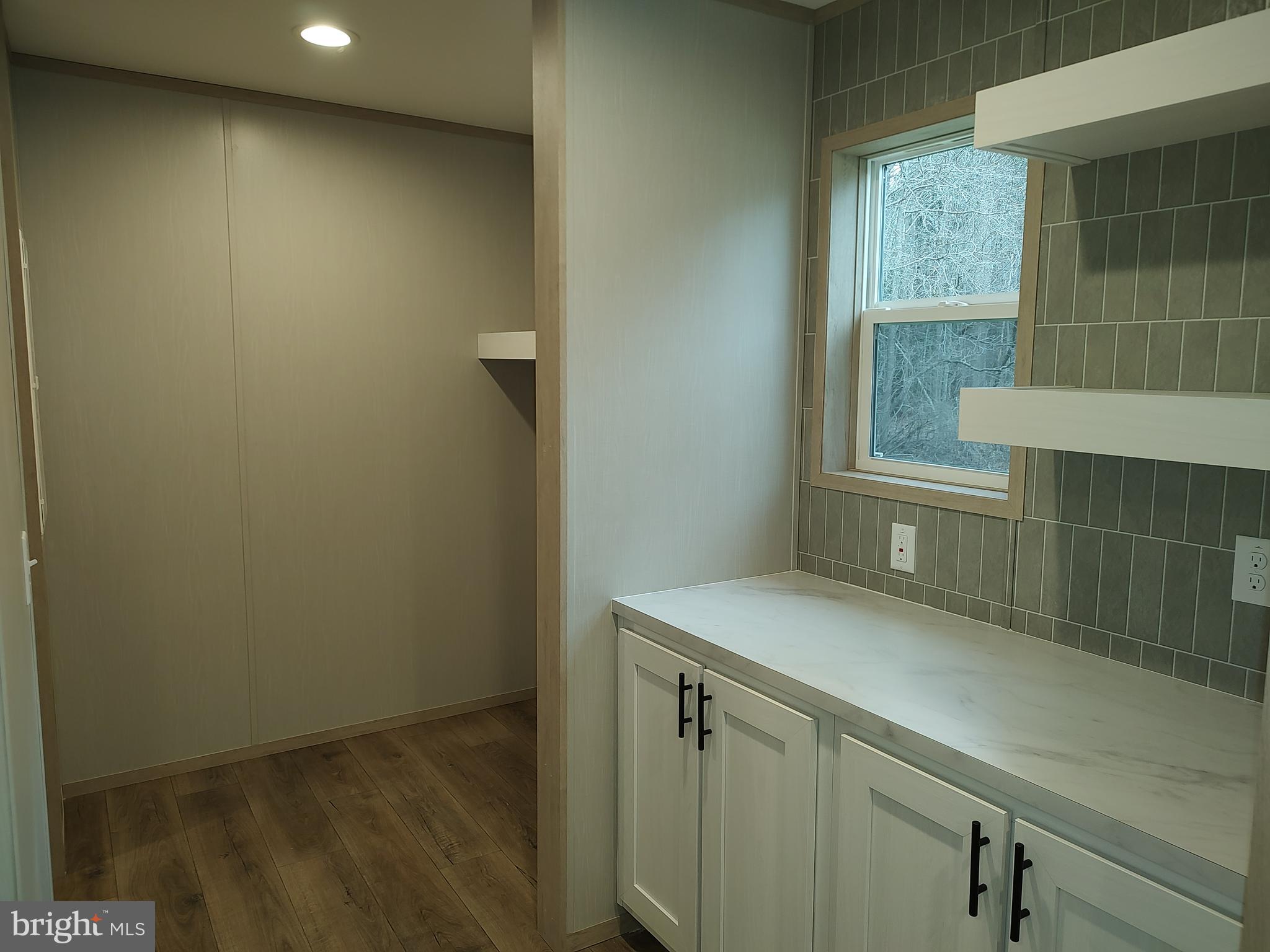 22525 Cedar Lane Georgetown, DE 19947 - Photo 14 of 24 a view of storage and utility room with window