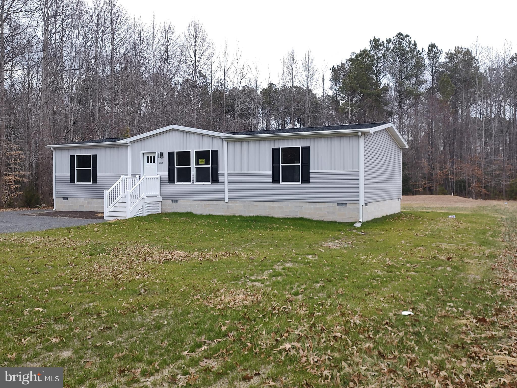 22525 Cedar Lane Georgetown, DE 19947 - Photo 2 of 24 a view of a house with a backyard