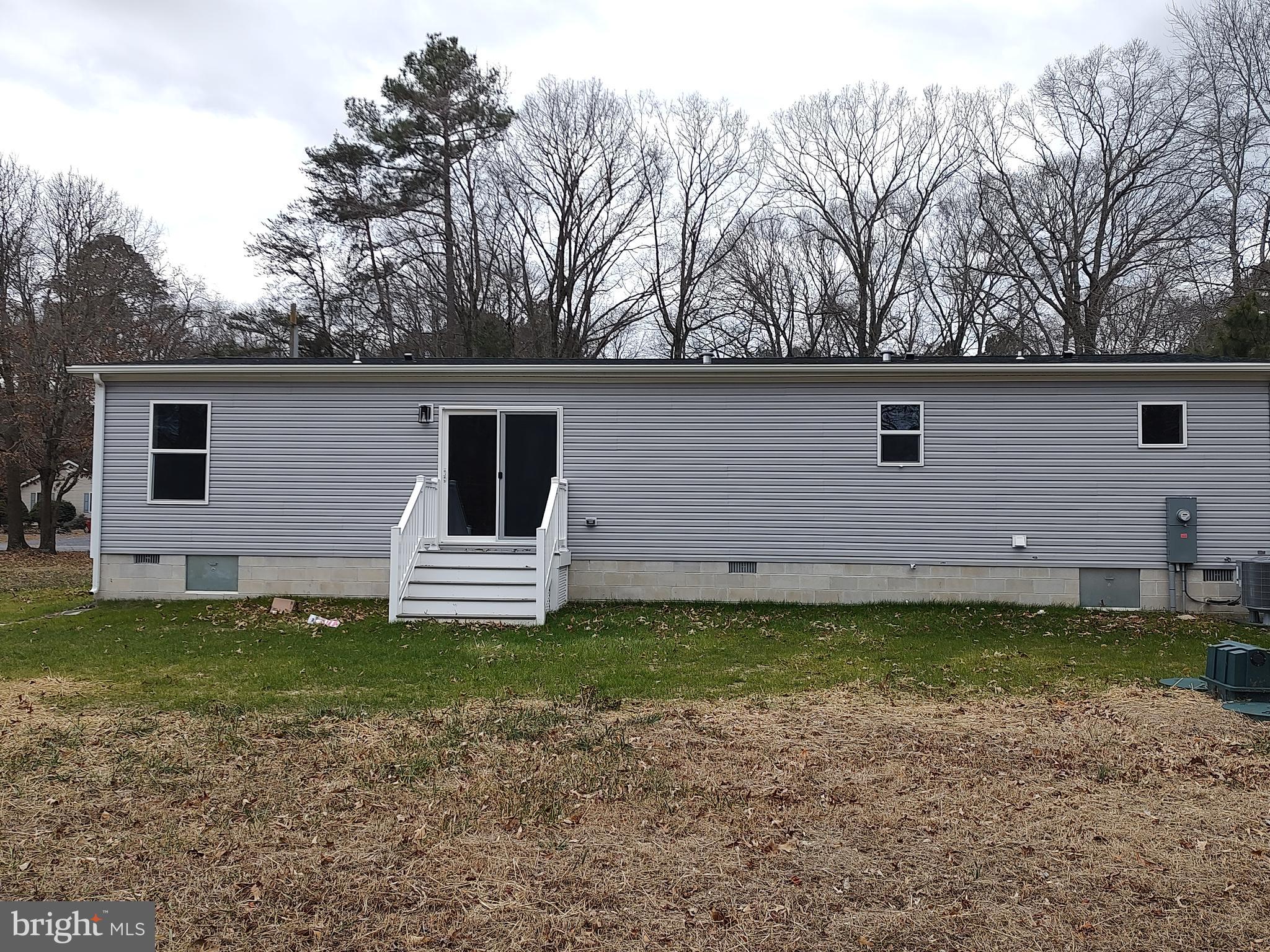 22525 Cedar Lane Georgetown, DE 19947 - Photo 4 of 24 a view of a backyard with a garden