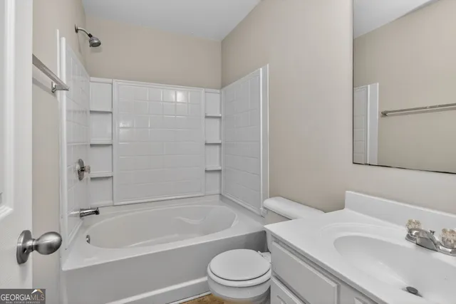 an empty room with windows and entrance