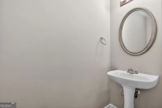 a view of a house with wooden fence