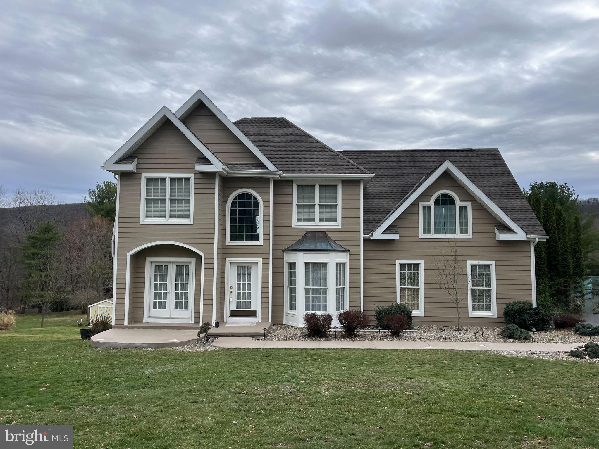 front view of a house with a yard