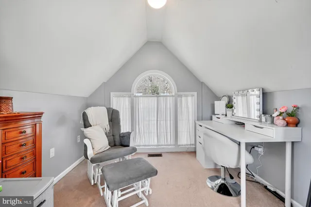 a workspace with furniture and a window