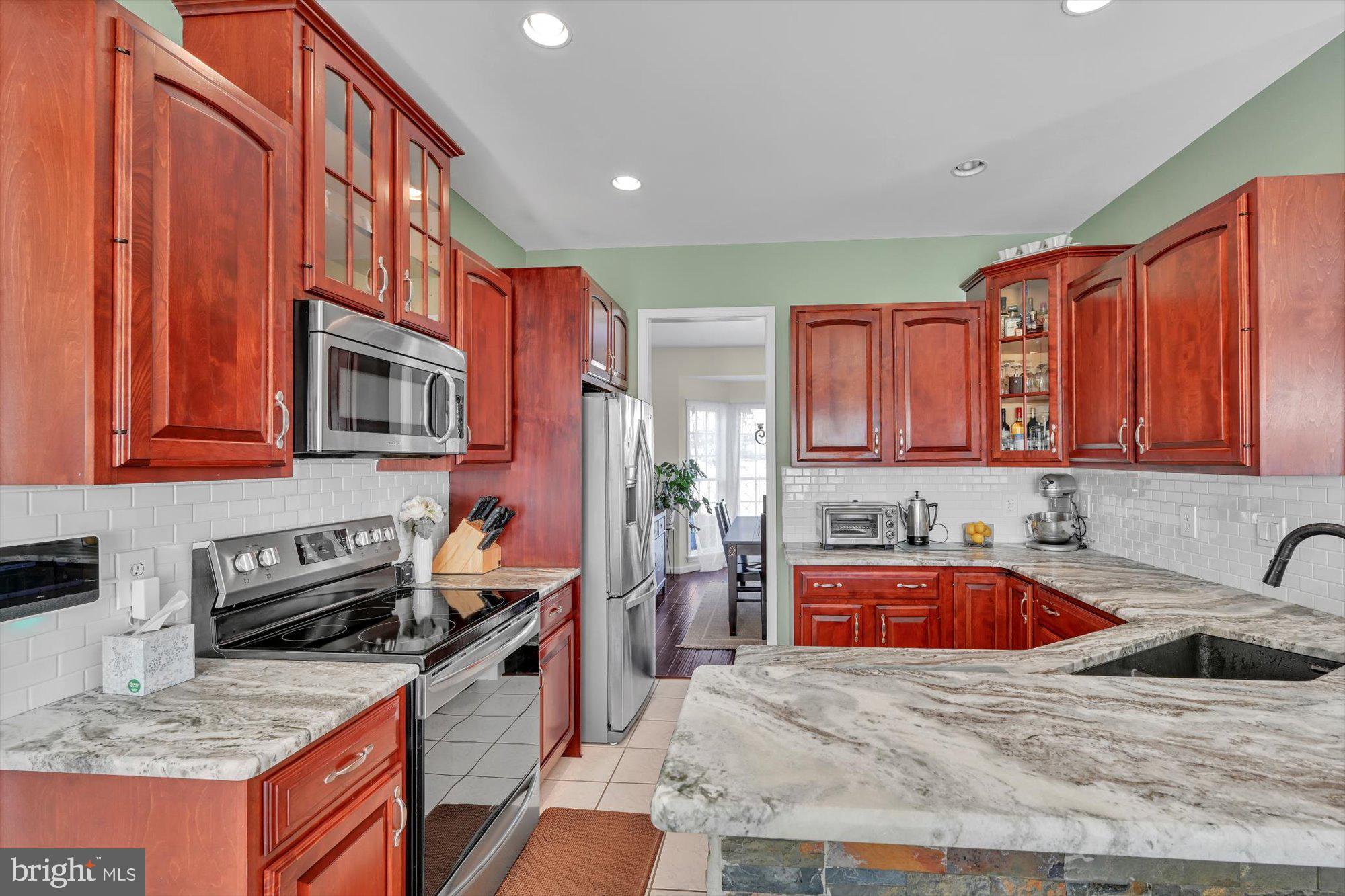 6 Jackson Road Pottsville, PA 17901 - Photo 2 of 36 a kitchen that has a sink stove and cabinets