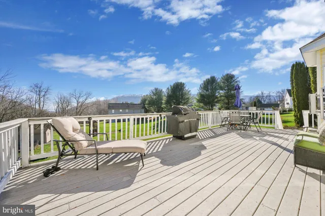 a view of a chairs on wooden deck
