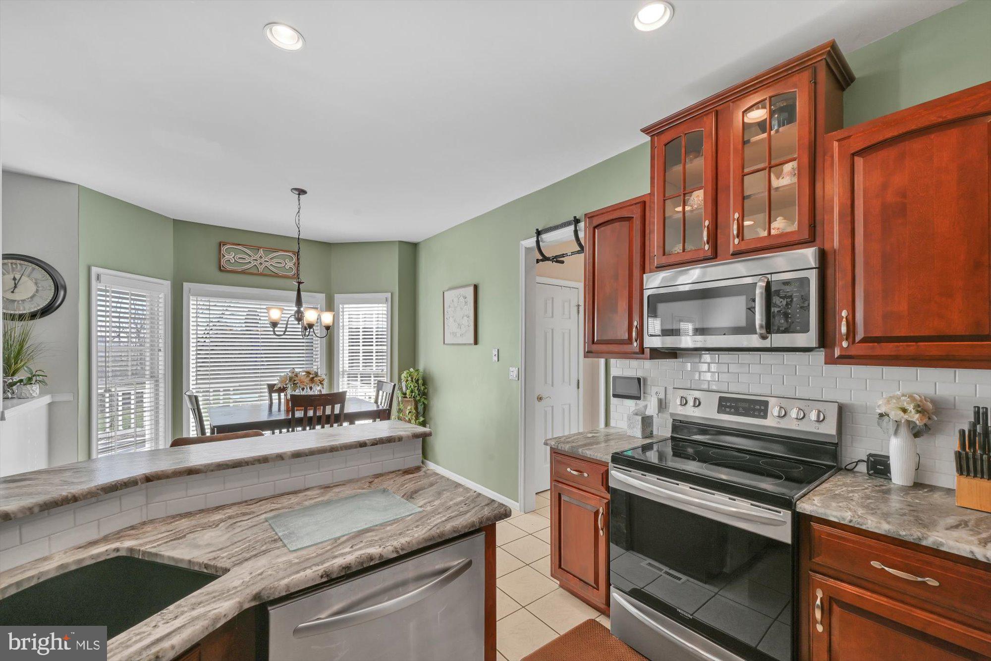 6 Jackson Road Pottsville, PA 17901 - Photo 3 of 36 a kitchen with stainless steel appliances granite countertop a stove a sink and a microwave