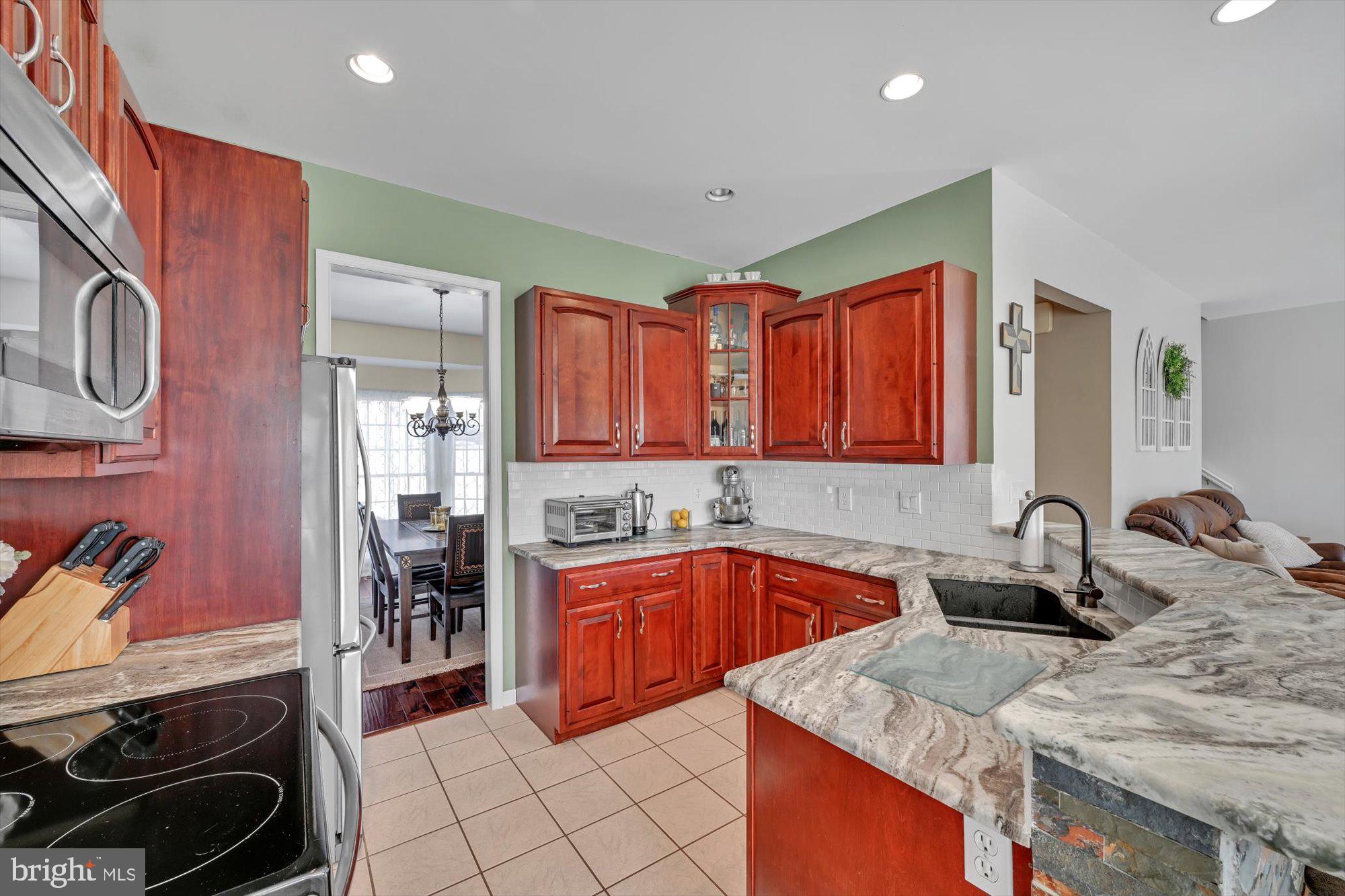 6 Jackson Road Pottsville, PA 17901 - Photo 4 of 36 a kitchen with stainless steel appliances granite countertop a sink stove and cabinets