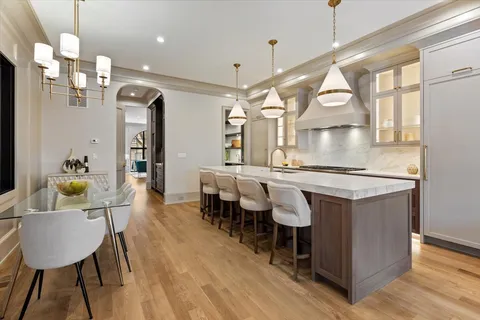 a kitchen with stainless steel appliances a sink and a stove