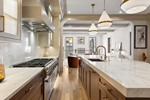 a kitchen that has a sink and a stove