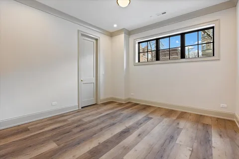 a view of an empty room and wooden floor
